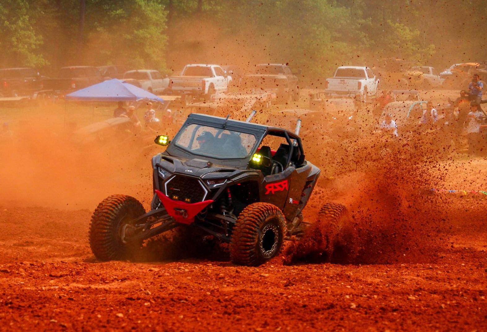 UTV kicking up red dirt at Iron Mountain Park